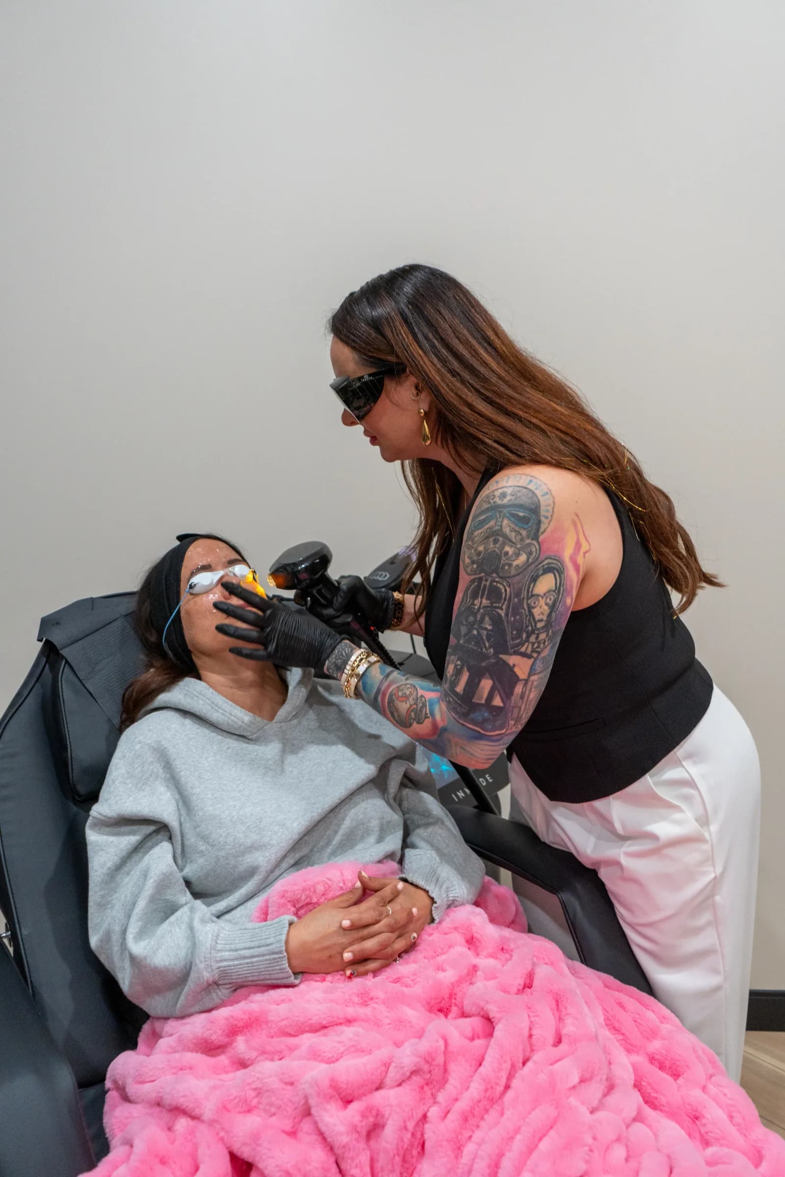 A laser hair removal pass, the operator in protective goggles